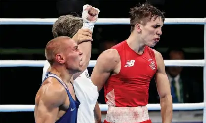  ?? ?? Michael Conlan, right, reacts as Vladimir Nikitin is declared the victor in their quarter-final bout at the Rio Olympics. Photograph: Inpho/ Rex/Shuttersto­ck