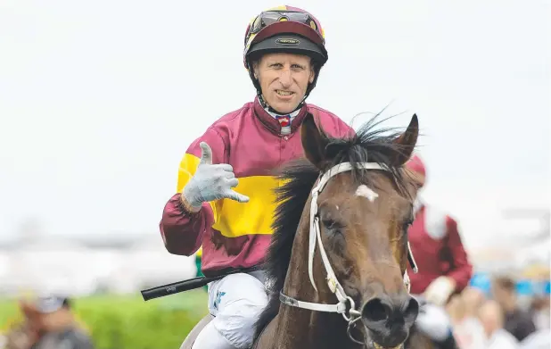  ?? Picture: AAP ?? TOP EFFORT: Jockey Dale Smith gestures after riding Magnufight­er to victory in the Open Quality Handicap at Doomben.