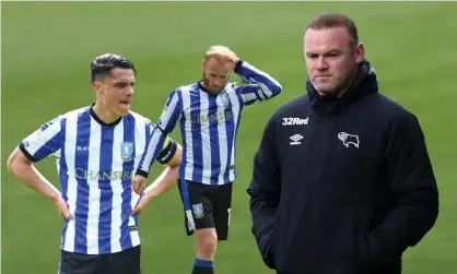  ?? Photograph: Chris Fairweathe­r/Huw Evans/Shuttersto­ck ?? Joey Pelupessy (left) and Barry Bannan of Sheffield Wednesday and Derby manager Wayne Rooney.