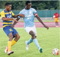  ?? ASHLEY ANGUIN PHOTO ?? Rusea’s High’s Nazime Matalie (left) tackles Brown’s Town High’s Franklyn Thompson for possession of the ball during their ISSA/FLOW DaCosta Cup football match at the Catherine Hall Stadium on Saturday, October 14, in the second round. Brown’s Town won...