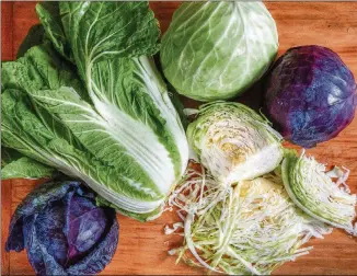  ?? STYLING BY CONNE WARD CAMERON; PHOTO BY CHRIS HUNT FOR THE AJC ?? St. Patrick’s Day is a good time to try napa cabbage ( the big leafy green one), red cabbage or green cabbage ( the round ones).