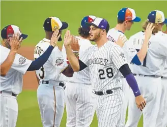  ?? Getty Images ?? Rockies third baseman Nolan Arenado is introduced Tuesday night, along with the rest of the National League squad, during the All-Star Game at Nationals Park.