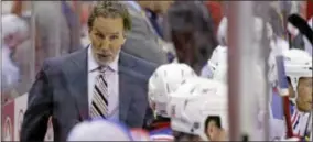  ?? ALEX BRANDON/ ASSOCIATED PRESS ?? New York Rangers head coach John Tortorella talks with his team in the second period of Game 5 in the first- round NHL Stanley Cup playoff series against the Washington Capitals.