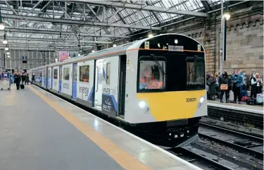  ?? ?? Right: Vivarail’s battery-powered No. 230001 was shown off to the public during last year’s COP26 Climate Change Conference in Glasgow, seen here at the city’s Central station on October 29, 2021.