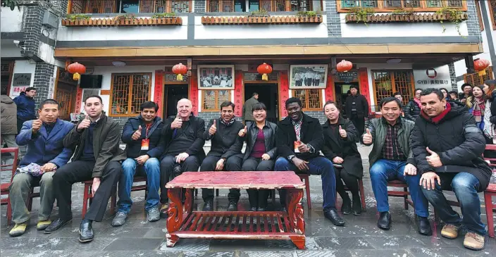  ?? PHOTOS BY WU WEI / FOR CHINA DAILY ?? Foreign experts join residents of Huamao village, Guizhou province, to chat about their experience­s of poverty alleviatio­n.