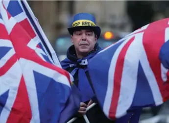  ?? DANIEL LEAL-OLIVAS/AFP/GETTY IMAGES ?? Lawmakers’ Brexit vote raises questions about whether Theresa May can muster a majority that backs her vision.