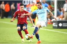  ??  ?? Silva (left) vies for the ball with Bayern Munich’s German defense Jonathan Meier during the Internatio­nal Champions Cup friendly match between FC Bayern Munich and Manchester City at Hard Rock Stadium in Miami, Florida. — AFP photo