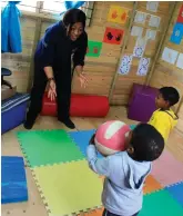  ??  ?? The new classroom is also used for therapy sessions. Here Regomodits­we Legodu, the physiother­apist, does some large motor skills exercises with the children.