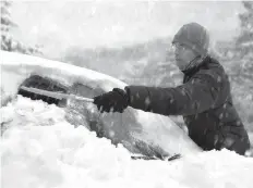  ?? 123RF ?? It’s not just clearing the frost or snow from a vehicle’s windows that’s important. Snow or ice on the hood, roof or trunk can and will fly off when driving.