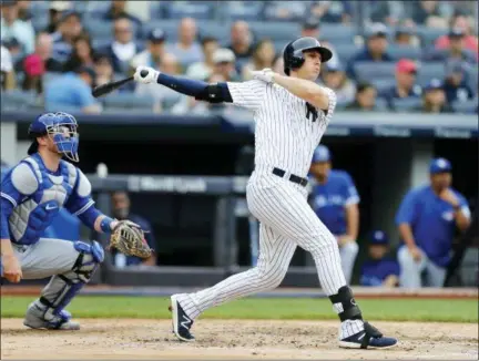  ?? NOAH K. MURRAY — THE ASSOCIATED PRESS ?? New York Yankees’ Greg Bird (33) follows through on a grand slam in the first inning of a baseball game against the Toronto Blue Jays, Sunday in New York.