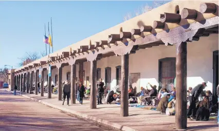  ?? COURTESY OF NEW MEXICO DEPARTMENT OF CULTURAL AFFAIRS ?? Native American artisans sell their art at the Palace of the Governors Portal. Vendors compete for a spot in the Native American Artisans Program, which guarantees the authentici­ty of their work.