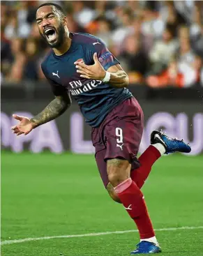  ??  ?? Simply dangerous: Arsenal striker Alexandre Lacazette celebratin­g after scoring against Valencia during the Europa League semi-final, second-leg match at the Mestalla Stadium on Thursday. — AFPAFP)