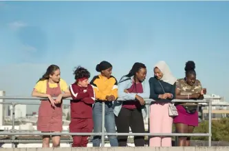  ??  ?? Below: rising star Bukky Bakray; Right: with her on-screen friends in the film Rocks.