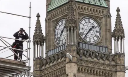  ?? PAUL CHIASSON, THE CANADIAN PRESS FILE PHOTO ?? Security officials say they’re ready for the huge crowds set to descend on Parliament Hill for Canada’s 150th birthday celebratio­n Saturday.