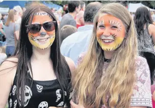  ??  ?? Lion queens: Carnival-goers were treated to a number of treats on Frimley Green, including face painting.