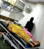  ??  ?? CHAOS THEORY Patients lying next to dead bodies in Sion Hospital, and relatives of patients with no PPE tending to their loved ones