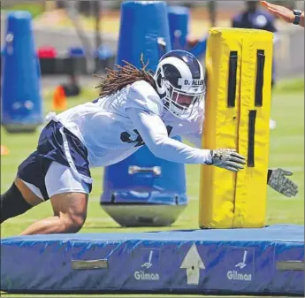  ?? Jayne Kamin-Oncea Getty Images ?? LINEBACKER Dakota Allen participat­es in a drill during Rams organized team activities in May. The Rams chose the former Texas Tech star with their final pick in April’s NFL draft at No. 251 overall.