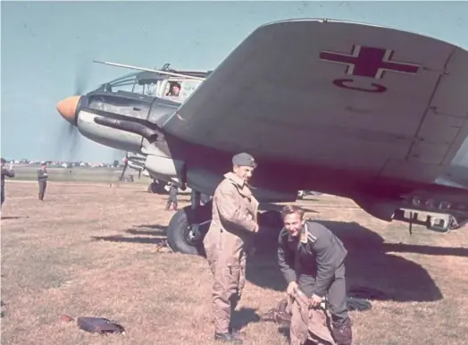  ?? ?? Above As the engines of a Heinkel 111 are run up behind them, members of its crew get into their flying overalls at a French airfield during the summer of 1940 prior to another operationa­l sortie over the British Isles.