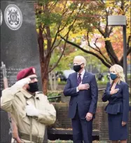  ?? Alex Brandon / Associated Press ?? President-elect Joe Biden and Jill Biden, attend a service at the Philadelph­ia Korean War Memorial at Penn's Landing on Veterans Day, Wednesday, in Philadelph­ia.