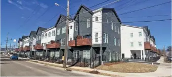  ?? STAFF PHOTO BY DAVE FLESSNER ?? The 58 townhomes in the Southside Square at 20th Street and Reed Avenue, shown Tuesday, sold out in about 10 months.