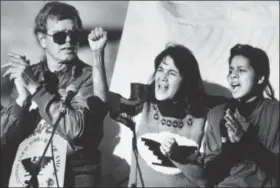  ?? COURT MAST — THE ASSOCIATED PRESS FILE ?? In this file photo, United Farm Workers leader Dolores Huerta, center, leads a rally along with Howard Wallace, President of the San Francisco chapter of the UFW, left, and Maria Elena Chavez, 16, the daughter of Cesar Chavez, right, in San Francisco’s...