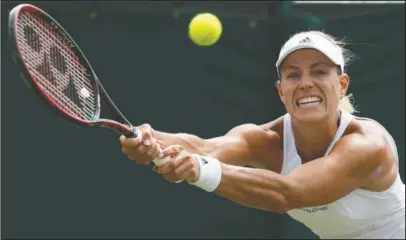  ?? The Associated Press ?? HAPPY RETURN: German Angelique Kerber returns to Shelby Rogers during her three-set win over the American in a Wimbledon third-round match Saturday.