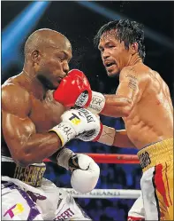  ?? Picture: AFP ?? CLASSIC PACMAN: Manny Pacquiao lands a left to the chin of Timothy Bradley Jr on his way to a convincing win in Las Vegas on Saturday.