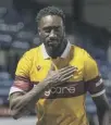  ??  ?? 0 Bevis Mugabi celebrates Motherwell’s win