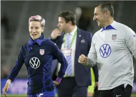  ?? AP PHOTO/PHELAN M. EBENHACK ?? U.S. coach Vlatko Andonovski, right, and forward Megan Rapinoe (15) laugh after the team’s win against Canada during a SheBelieve­s Cup soccer match Thursday, Feb. 16, 2023, in Orlando, Fla.