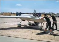  ?? PROVIDED TO CHINA DAILY ?? Technician­s from the China Academy of Aerospace Aerodynami­cs prepare a CH-3 unmanned aircraft for a prospectin­g flight in Zambia.