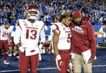  ?? File photo/NWA Democrat-Gazette/BEN GOFF ?? Arkansas quarterbac­k K.J. Jefferson (13), running back Rakeem Boyd and a staff member react Oct. 12 after a 24-20 loss to Kentucky at Kroger Field in Lexington, Ky.