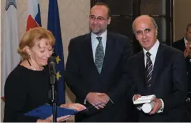  ??  ?? Slovak Ambassador to Malta H.E. Maria Krasnohors­ka reading out the Citation of the Award of the Slovak Deputy Prime Minister and Minister for Foreign and European Affairs to Honorary Consul of the Slovak Republic Godwin E. Bencini. Also in picture is...