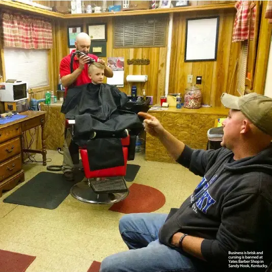  ??  ?? Business is brisk and cursing is banned at Yates Barber Shop in Sandy Hook, Kentucky.