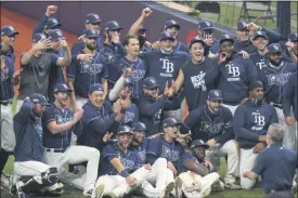  ?? CHRIS O’MEARA — THE ASSOCIATED PRESS ?? The Tampa Bay Rays celebrate after winning their wild-card series in St. Petersburg, Fla., on Wednesday.