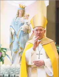  ?? Associated Press ?? Archbishop Jose H. Gomez gives a blessing after leading a brief liturgy at the Cathedral of Our Lady of the Angels in Los Angeles in May. Federal lobbying records show Gomez, who heads the U.S. Conference of Catholic Bishops, paid a firm $20,000 to lobby the U.S. Senate and House on “eligibilit­y for nonprofits” under the CARES Act in 2020.