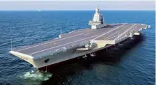  ?? AP ?? Setting sail: China’s third aircraft carrier, Fujian, conducts its maiden sea trial on May 01.