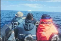  ?? TRINITY ECO-TOURS, ROBERT BARTLETT/VIA CP ?? The province is falling short so far this year on a prized tourist attraction: icebergs. An iceberg is seen in the distance as boaters look on in an undated handout image.