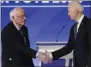  ?? CHARLES KRUPA—ASSOCIATED
PRESS ?? Democratic presidenti­al candidates Sen. Bernie Sanders, I-Vt., left, and former Vice President Joe Biden, shake hands on stage Friday, Feb. 7, 2020, before the start of a Democratic presidenti­al primary debate hosted by ABC News, Apple News, and WMUR-TV at Saint Anselm College in Manchester, N.H.