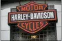  ?? DAVID ZALUBOWSKI — THE ASSOCIATED PRESS FILE ?? The company logo hangs over the entrance to a Harley Davidson dealership in Littleton, Colo.