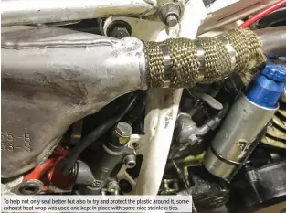  ??  ?? To help not only seal better but also to try and protect the plastic around it, some exhaust heat wrap was used and kept in place with some nice stainless ties.