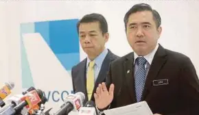  ?? PIC BY SYARAFIQ ABD SAMAD ?? Transport Minister Anthony Loke (right) speaking during a press conference at the Malaysian Aviation Commission in Kuala Lumpur yesterday. With him is ministry deputy secretary-general Mohd Khairul Adib Abd Rahman.