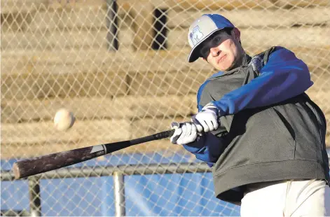  ?? PHOTOS BY CLYDE MUELLER/THE NEW MEXICAN ?? St. Michael’s William Brandt takes a swing at a pitch during batting practice Wednesday at Christian Brothers Athletic Complex at St. Michael’s High School.