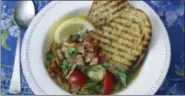  ?? SARA MOULTON VIA AP ?? Clam, tomato and bacon stew with grilled garlic bread.