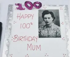  ??  ?? A picture of Sheila Dunn as a young woman on her 100th birthday cake.