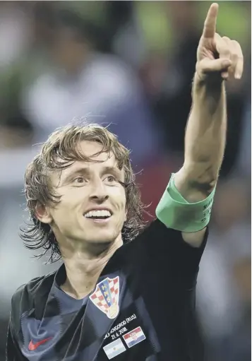  ??  ?? Luka Modric celebrates after scoring Croatia’s second goal in the 3-0 win over Argentina.