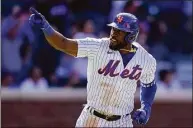  ?? John Minchillo / Associated Press ?? The Mets’ Starling Marte runs the bases after hitting a three-run home run against the Diamondbac­ks on Friday in New York.