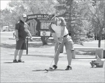  ?? Herald photo by J.W. Schnarr ?? Wayne Koenders tees off while Stuart Peebles looks on at Indian Hill Golf Course and Campground south of Coaldale on Friday. The facility has received $85,000 worth of in-kind grant funding through the Community Facility Enhancemen­t Program....