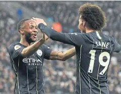  ?? AFP ?? Manchester City’s Raheem Sterling, left, celebrates with Leroy Sane.