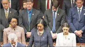  ?? J. Scott Applewhite / Associated Press ?? U.S. Rep. Jahana Hayes, D-Conn., (center) during an opening prayer as the House of Representa­tives assembles for the first day of the 116th Congress on Jan. 3, 2019.