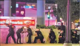  ?? REUTERS ?? Dallas police in action at the scene of the attack.